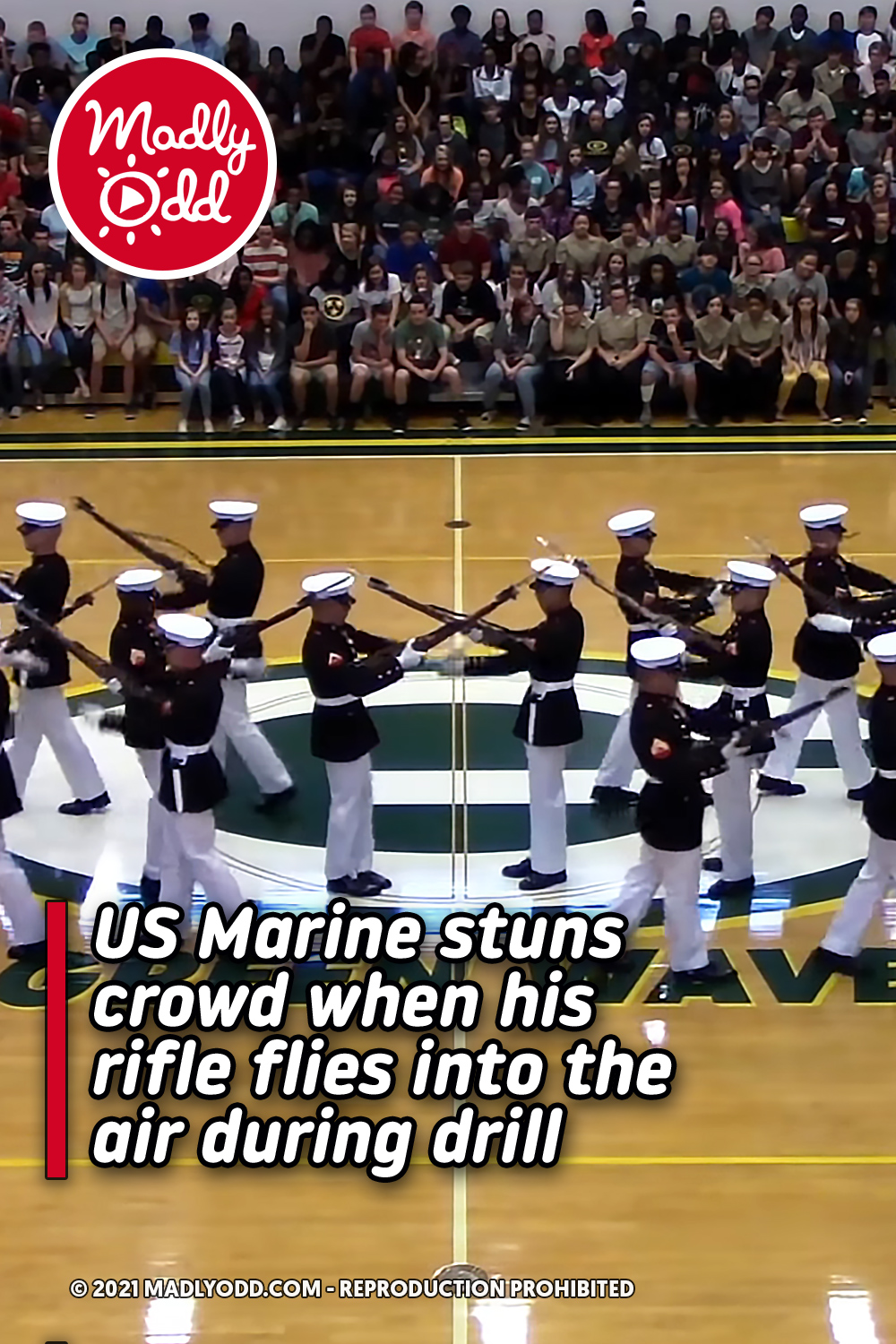 US Marine stuns crowd when his rifle flies into the air during drill