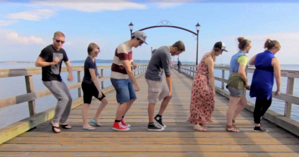 8 People dancing on a pier/boardwalk