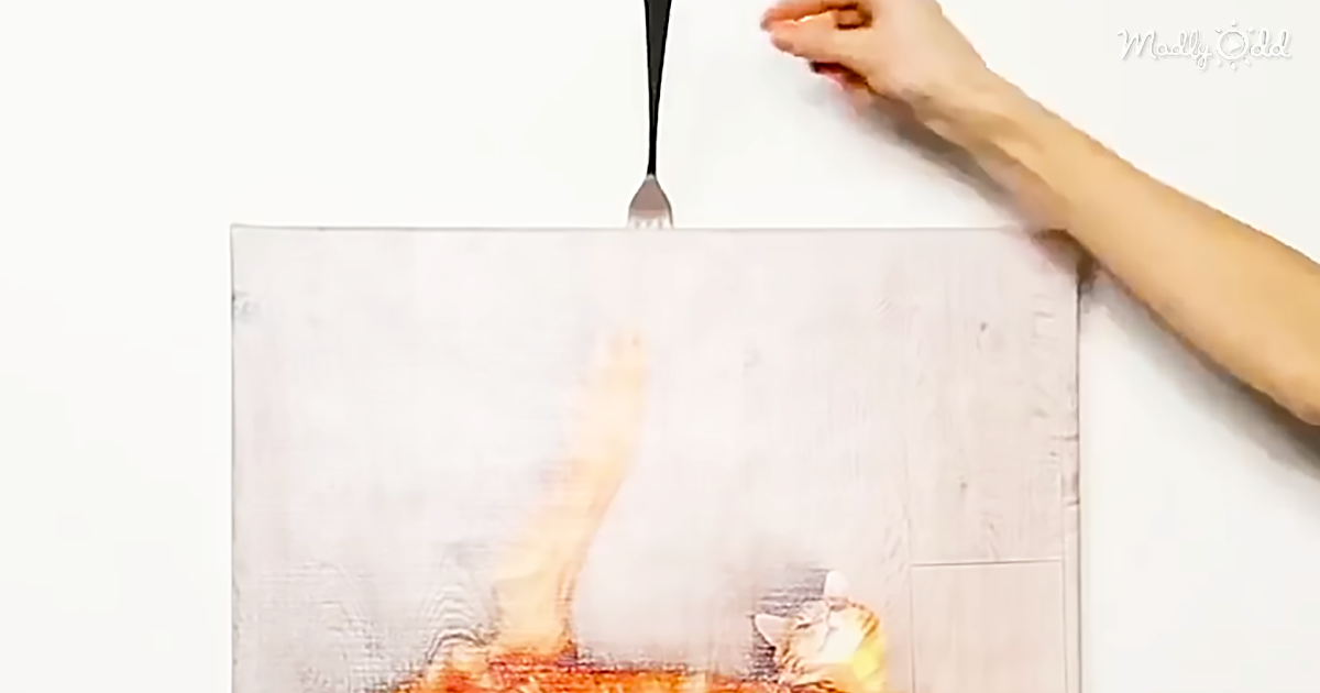 This Life Hack Will Show You How To Hang A Picture Using a Fork