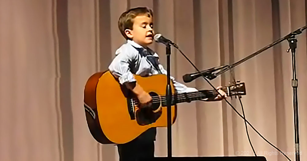 2nd grader grabs his guitar and blows away the house with a Johnny Cash classic