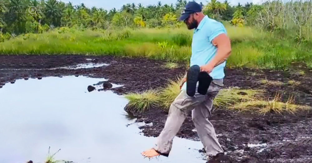 Man uses a shortcut across muddy water