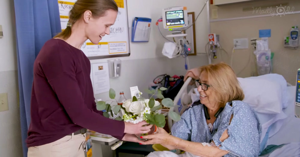 Doctor giving flowers to lonely patients