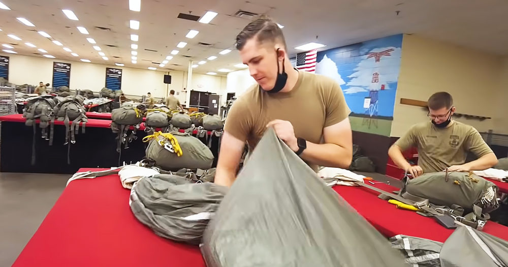 Soldiers packing parachute