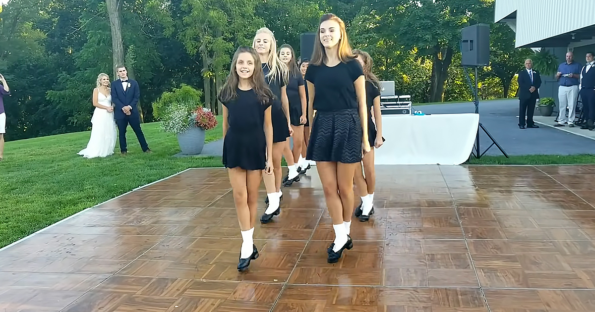 Students performing Irish stepdance at teacher’s wedding