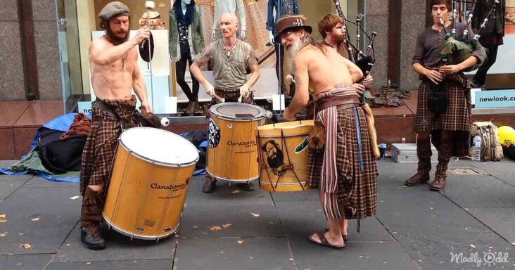 Scotsmen performing bagpipe and drum music