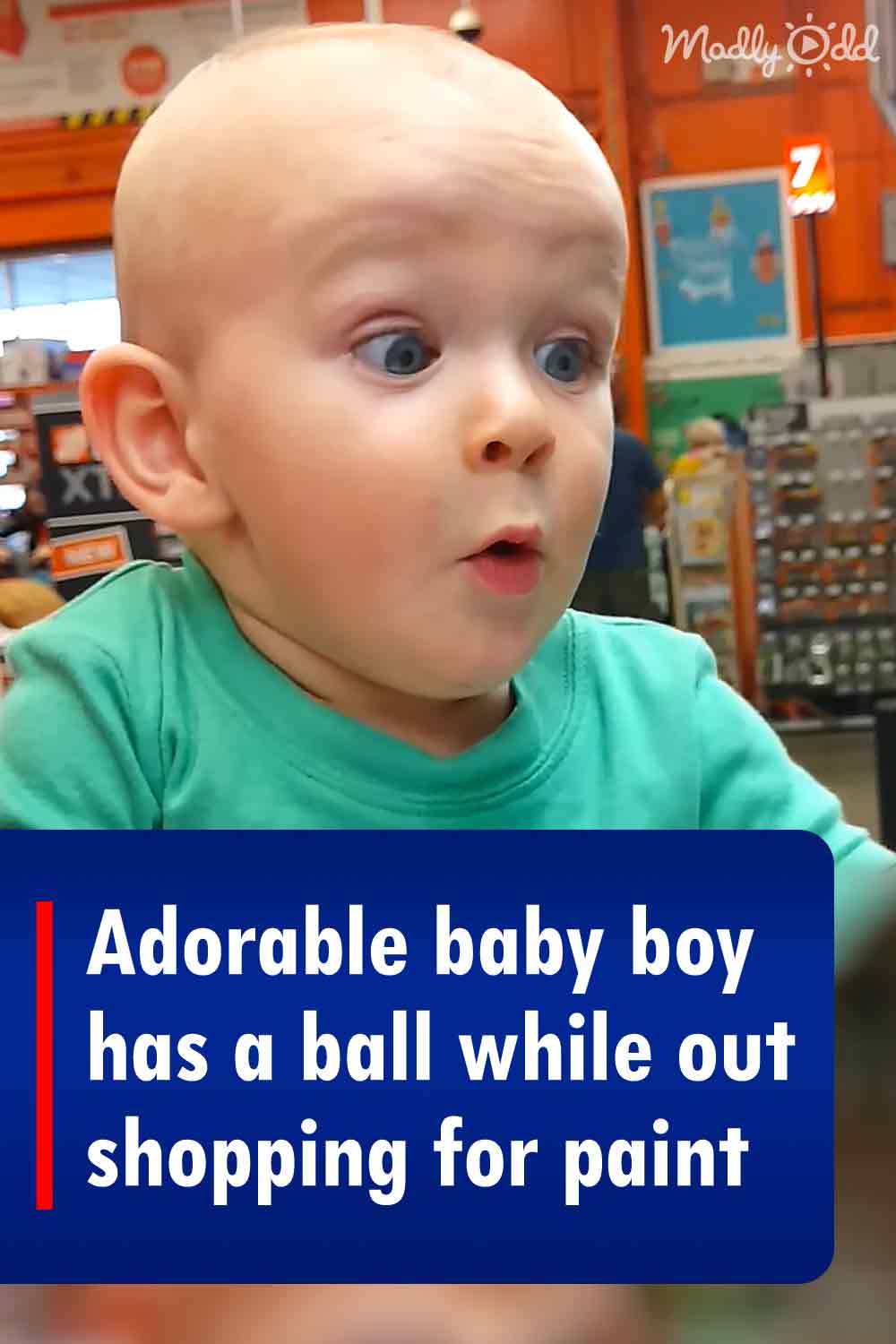 Adorable baby boy has a ball while out shopping for paint