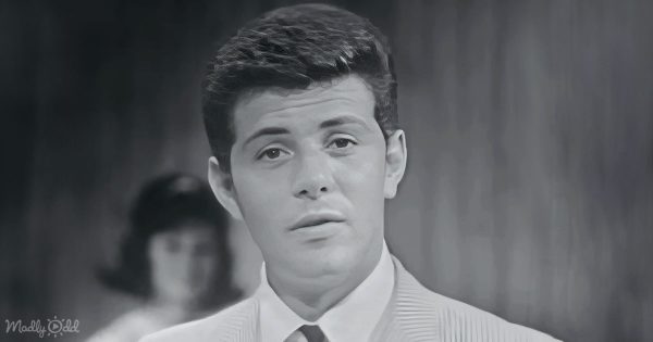 Frankie Avalon in a late 1950s suit, serenading with 'Venus' against a romantic backdrop.