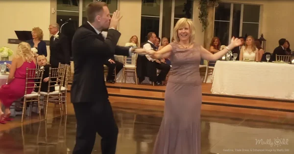 The groom and his mom shocked everyone with their surprise routine. Their moves were on point as they boogied across the dance floor, cracking up the entire crowd. The best part was seeing how much fun they were having together. This dance video captures such a special moment between a mother and her son on his big day. #wedding #mothersondance #dancing